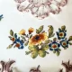 Particolare floreale vaso da fiori a mezzaluna di maiolica manganese